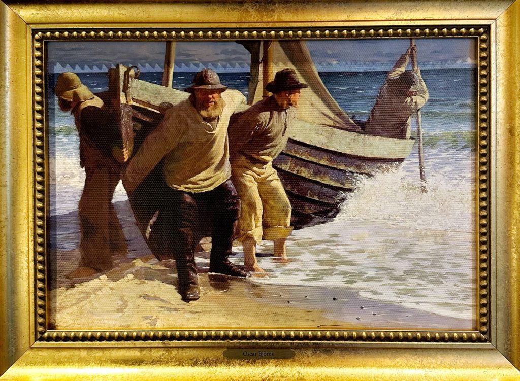 Maleriet Båden sættes i søen av Oscar Bjørk